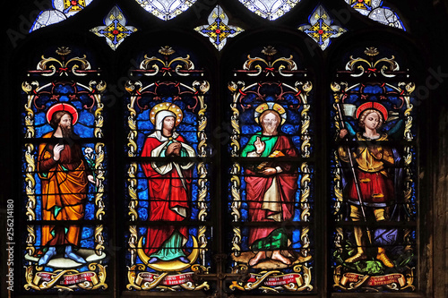 Saint Joseph, Mary, Jesus and Archangel Michael, stained glass window from Saint Germain-l'Auxerrois church in Paris, France