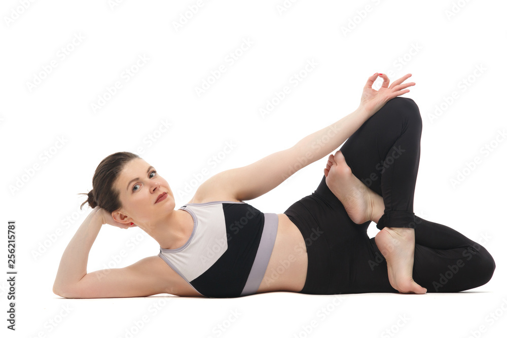 Girl practicing yoga isolated on white background.