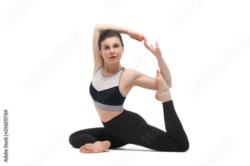 Fototapeta Naklejka Na Ścianę i Meble -  Girl practicing yoga isolated on white background.