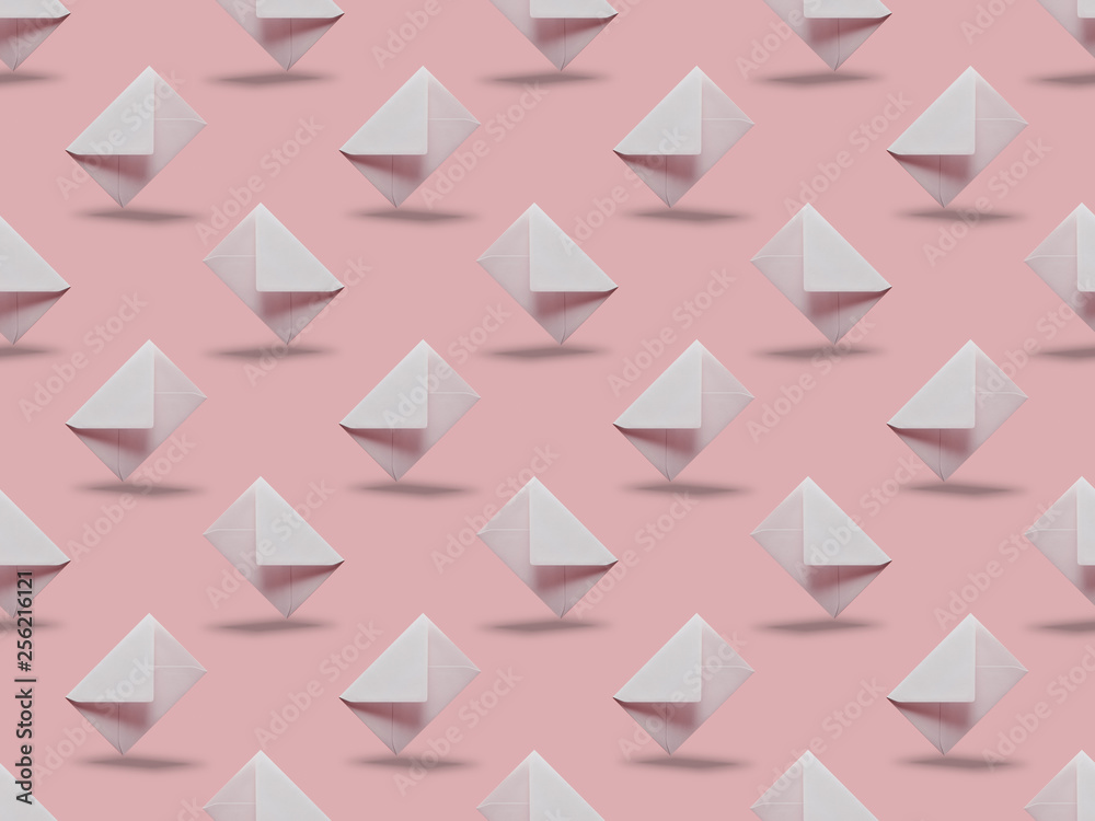 white and empty envelopes on pink background with copy space white and empty envelopes on pink background with copy space