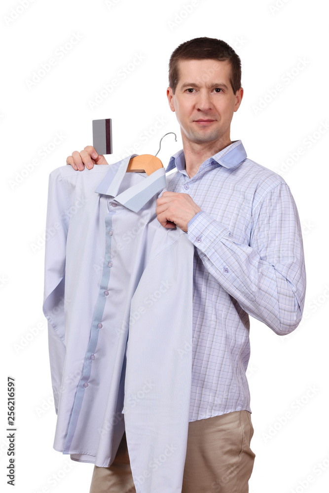 the man holds a coat hanger with a shirt and the plastic card on a white background