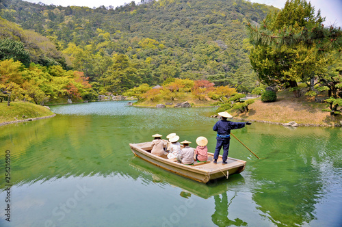Visitors enjoy a boat ride in the famous Ritsurin Koen Japanese Gardens, Takamatsu