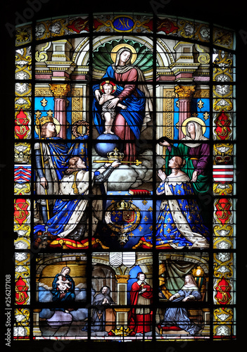 Mary and Child  King Louis IX holding the crown of thorns  King Louis XIII and his wife Anna of Austria  stained glass in the Basilica of Notre Dame des Victoires