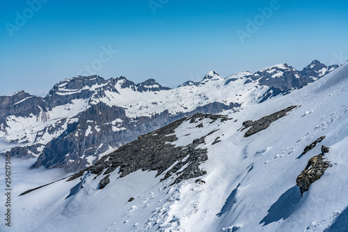 Switzerland, panorama view from Titlis mountain on Alps and mountains above white clouds © AlehAlisevich