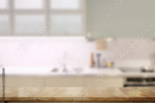 Wooden counter tops table with modern kitchen room background..