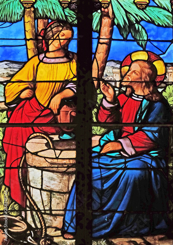 Jesus and Samaritan woman at the fountain, stained glass windows in the Saint Eugene - Saint Cecilia Church, Paris, France