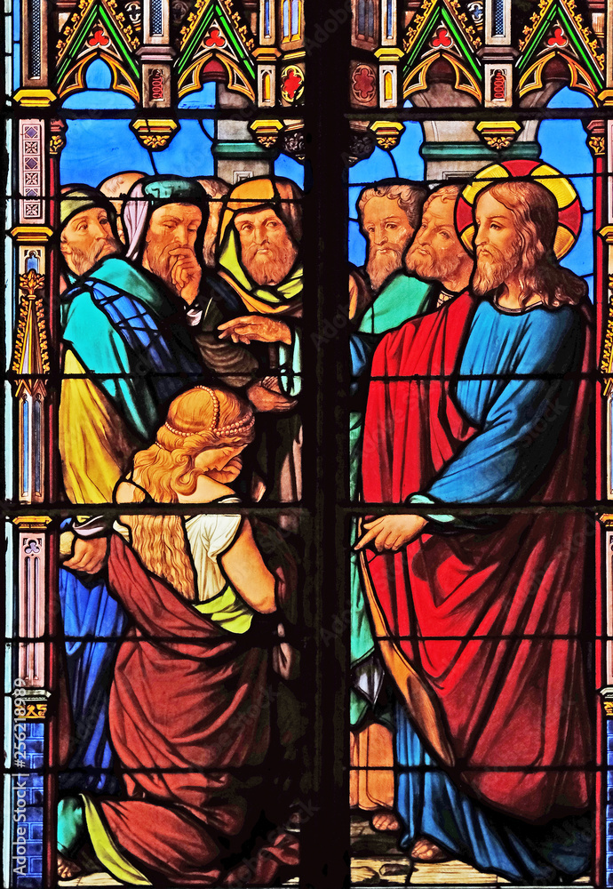 Obraz premium Forgiveness to the adulterous woman, stained glass windows in the Saint Eugene - Saint Cecilia Church, Paris, France