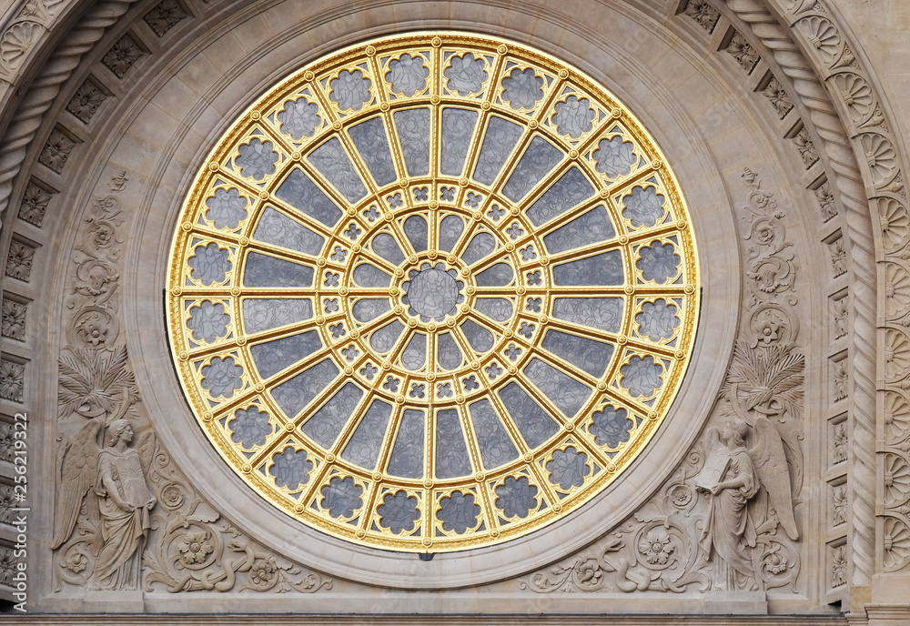 Rose window on the facade of Saint Augustine church in Paris, France 