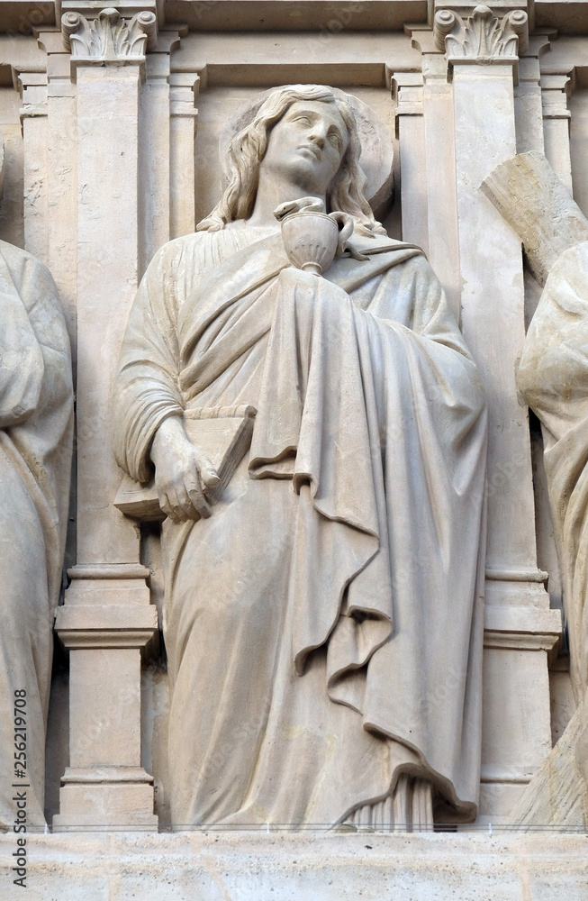 Saint John the Apostle, statue on the facade of Saint Augustine church in Paris, France 