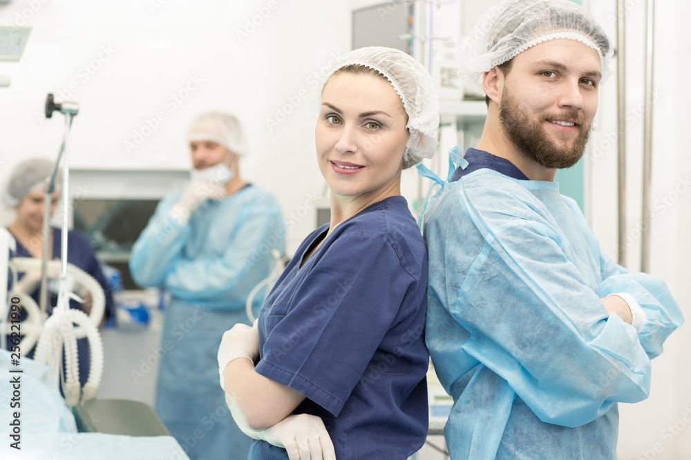 Fototapeta premium Surgical team posing in an operating theatre