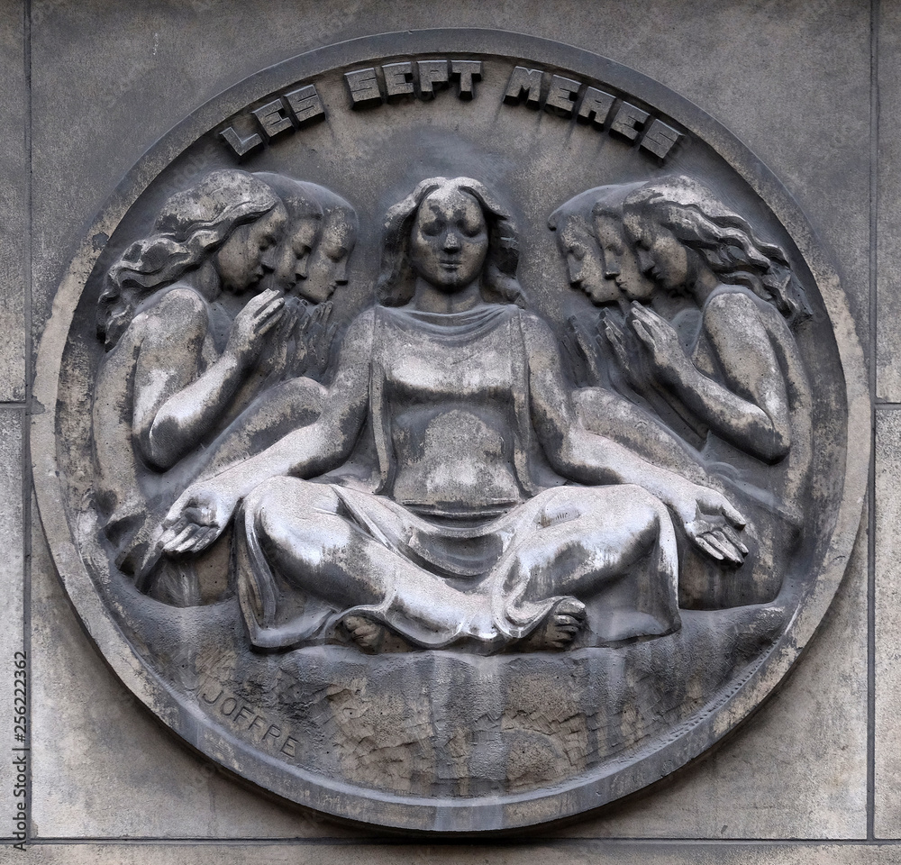 The seven mothers. Stone relief at the building of the Faculte de Medicine Paris, France 