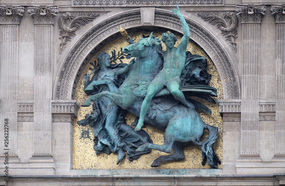 Genius of the Arts Astride Pegasus by Marius Jean Antonin Mercie, architectural detail of the Louvre Museum, one of major landmark in Paris, France 