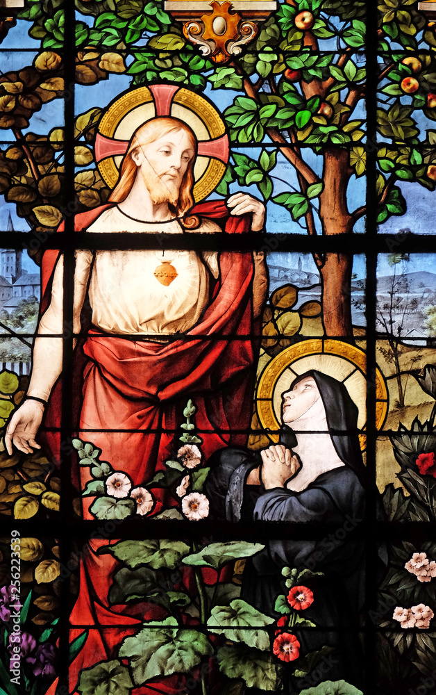 Obraz premium Apparition of the Sacred Heart to Marguerite Marie Alacoque, stained glass windows in the Saint Gervais and Saint Protais Church, Paris, France