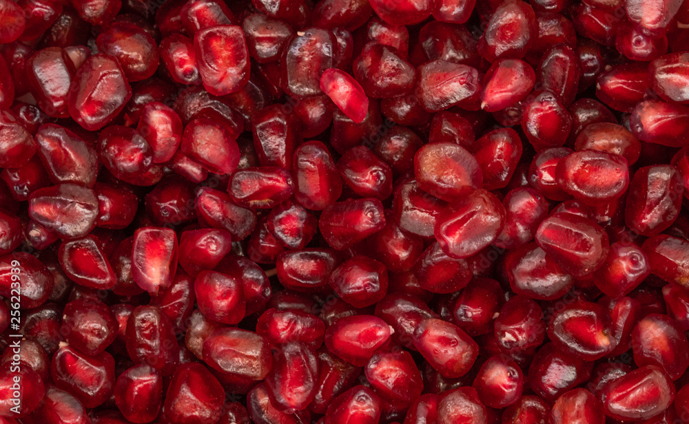 Texture of red peeled pomegranate background Texture of red peeled pomegranate background