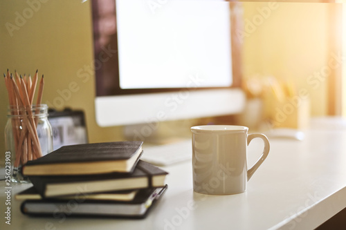 Fototapeta Naklejka Na Ścianę i Meble -  Mug of coffee on creative desk.