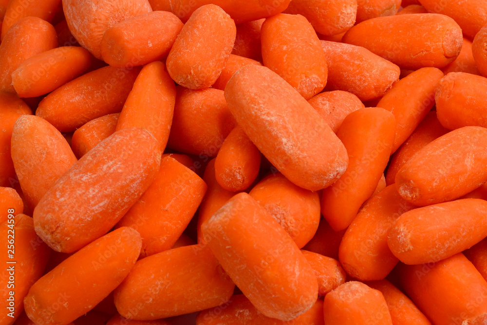 Little fresh carrots as a background. Snack. Little fresh carrots as a background. Snack.