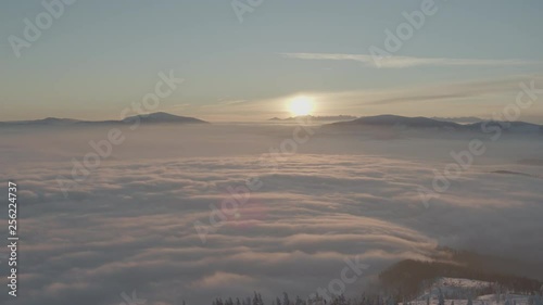 Wallpaper Mural Aerial drone view of sunrise in snowy mountains over clouds and white trees in winter  Torontodigital.ca