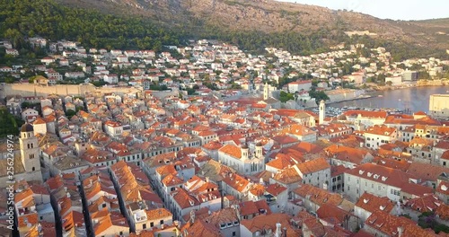 Aerial view of roofs of old town Dubrovnik Croatia. Drone flies over old roofs on sunset