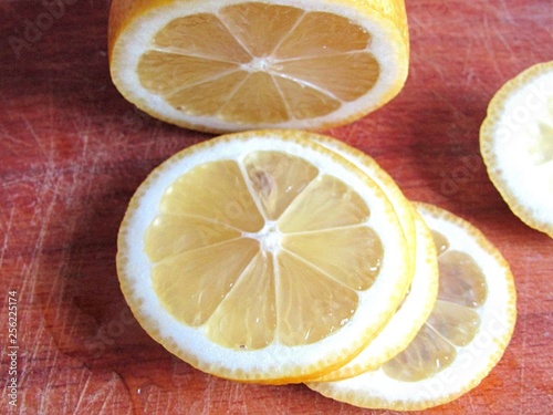 slices of lemon on wooden board
