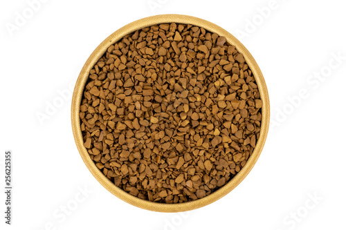 Granulated coffee in a wooden plate (cup) isolated on white background