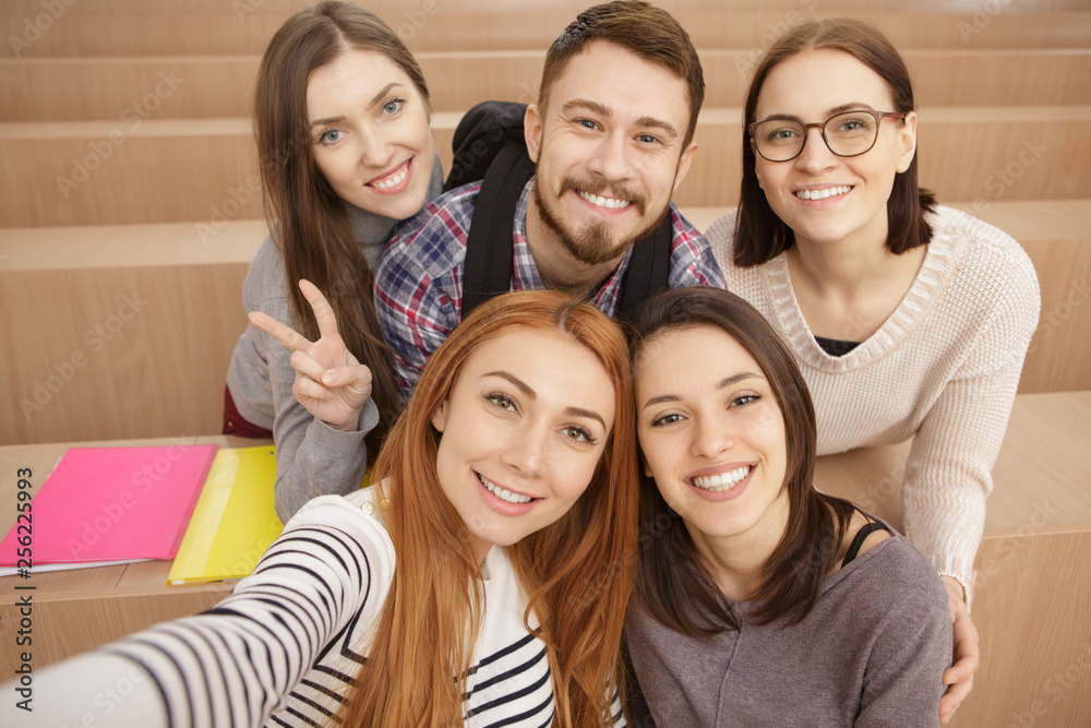 Diverse group of cheerful college students on campus Diverse group of cheerful college students on campus