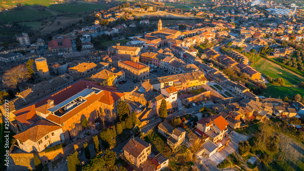aerial view from a drone of a rural town in italy at sunset