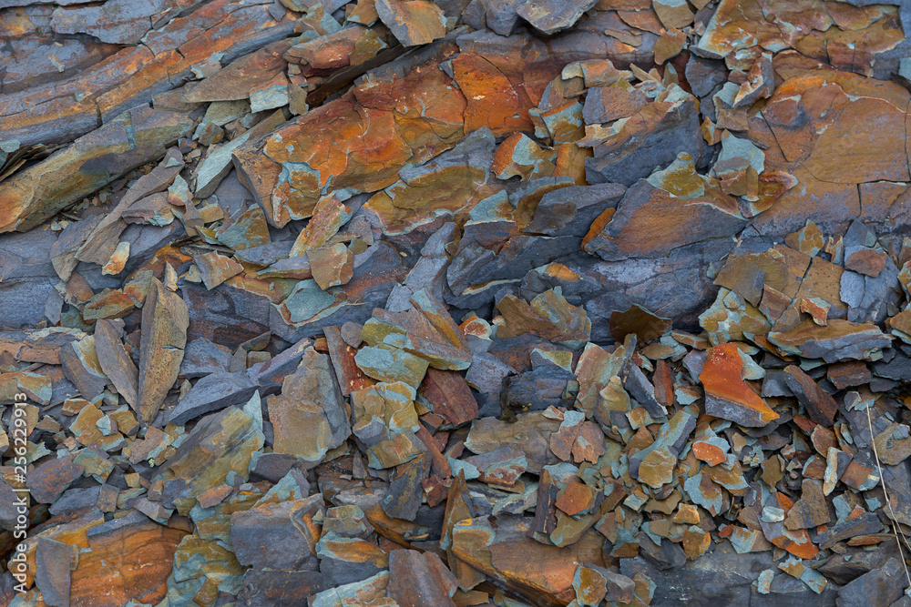 Orange and grey slate rocks, Île-aux-Lièvres, Quebec, Canada