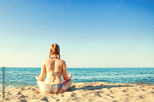 Young girl on sea beach. Vacation and holiday concept