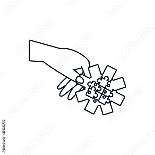 hand with puzzle pieces in shape pinion