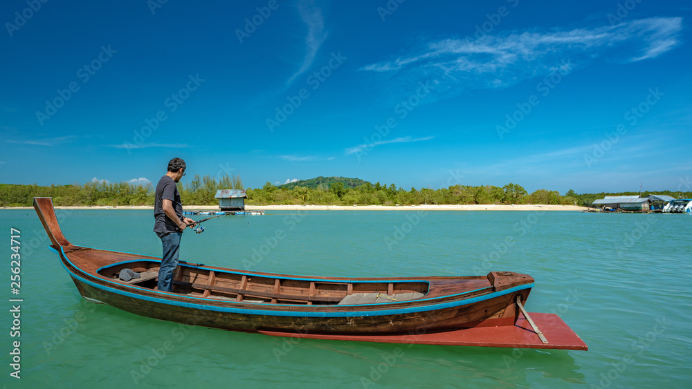 Fisherman On Boat With Island Sea View Background