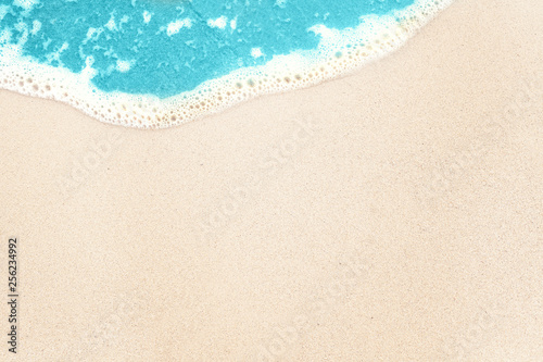 Tropical background with white sea beach sand and blue surf texture background © artmim