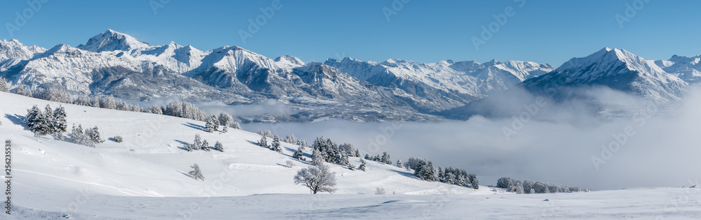 Champsaur Valley, Hautes-Alpes, European Alps, France: Panoramic Winter view on the valley with Chaillol Peak and Autane mountain range from Gleize Pass