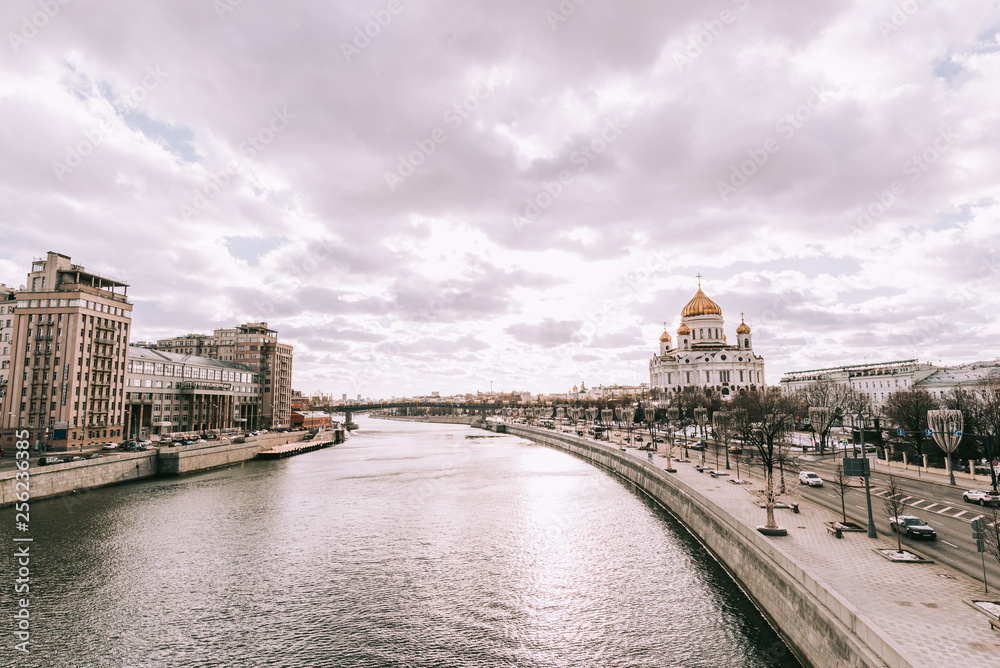 Fototapeta premium City landscape with view on Moscow Kremlin and reflections in waters of Moskva river.