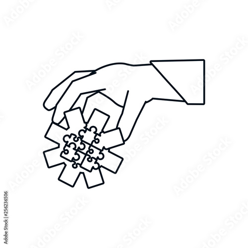 hand with puzzle pieces in shape pinion