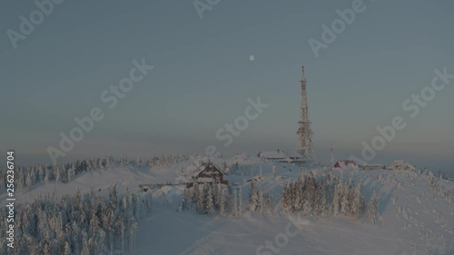 Wallpaper Mural Aerial drone view of shelter and transmitter tower at sunrise in winter in mountains with full moon in background  Torontodigital.ca