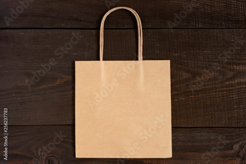 Mock-up of paper shopping bag lying on the table