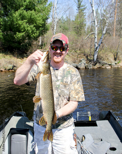 Fisherman holding a Northern Pike