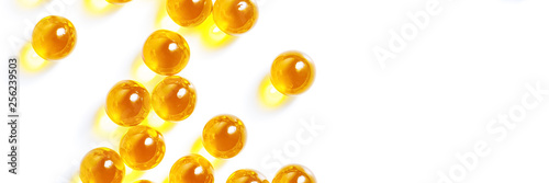 Yellow pills tablet on a white background.