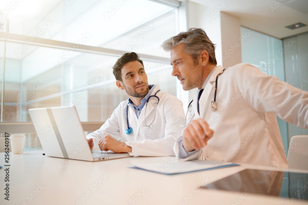 Doctors going over patient's results in hospital Doctors going over patient's results in hospital