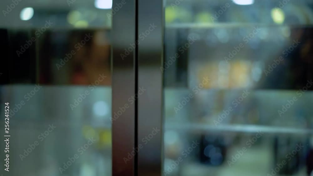 Elevator with transparent doors in the shopping center. Passes from the lower floor to the upper one. Elevator with transparent doors in the shopping center. Passes from the lower floor to the upper one.