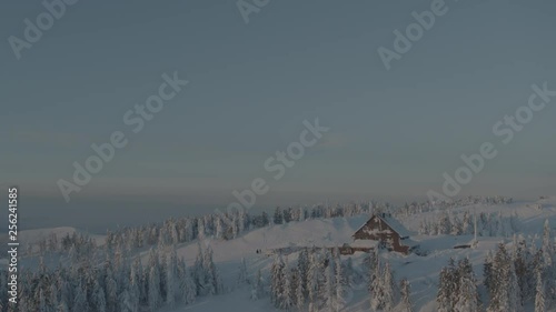 Wallpaper Mural Aerial drone view of shelter and transmitter tower at sunrise in winter in mountains with full moon in background  Torontodigital.ca