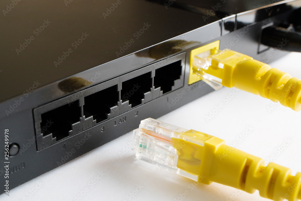 one cable is inserted into the router the second lies next to the router one cable is inserted into the router the second lies next to the router