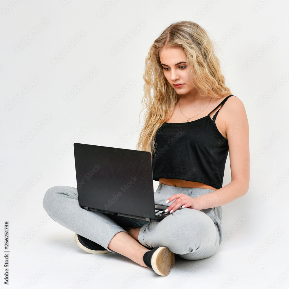 Fototapeta premium Beauty Woman Portrait. model Girl sitting on the floor freelancer with Perfect Clean Skin.