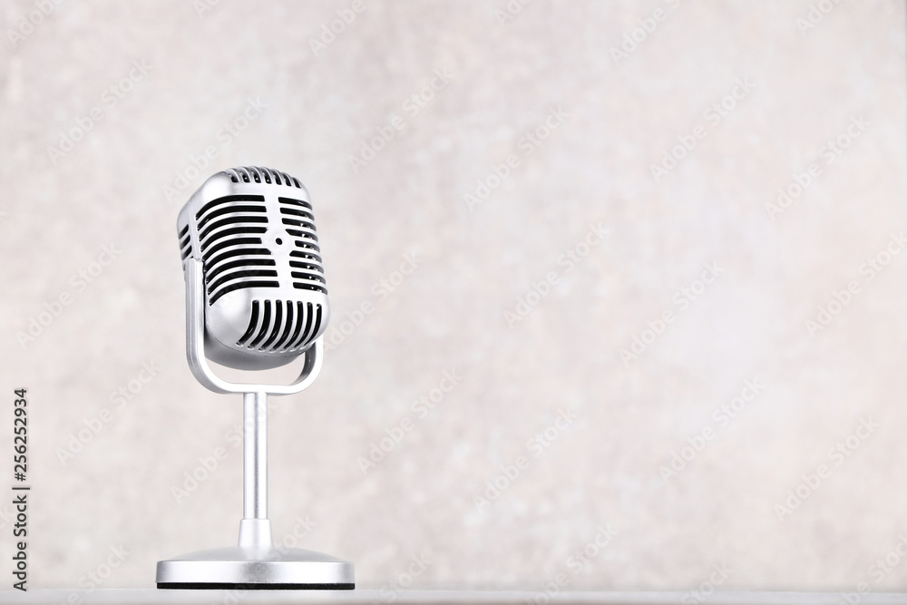 Fototapeta premium Vintage microphone on grey background