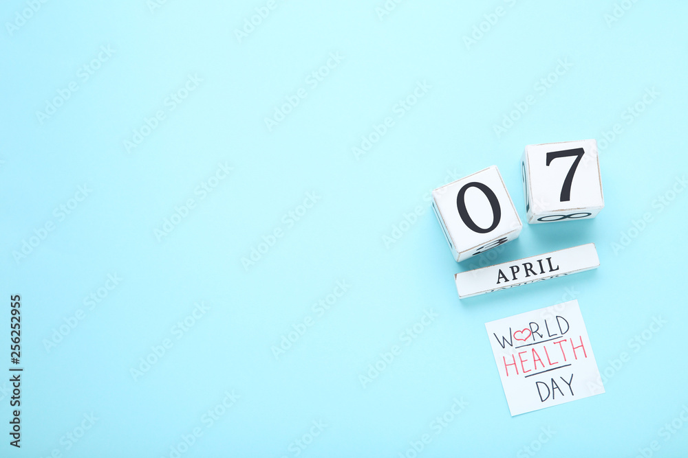 Text World Health Day with cube calendar on blue background Text World Health Day with cube calendar on blue background