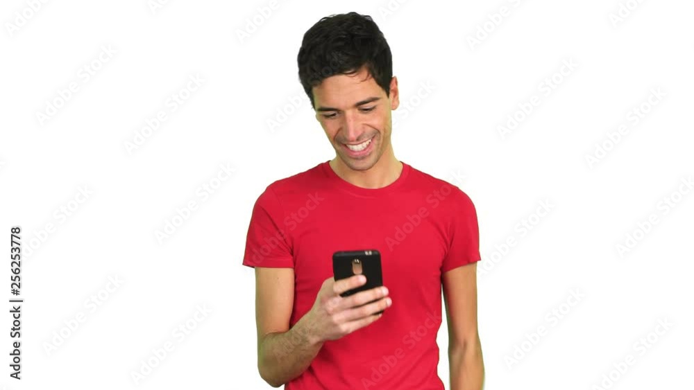 Young man looking at screen of smart phone isolated on white Young man looking at screen of smart phone isolated on white