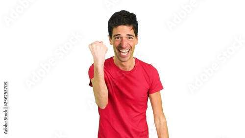 Handsome young man in a victory pose photo