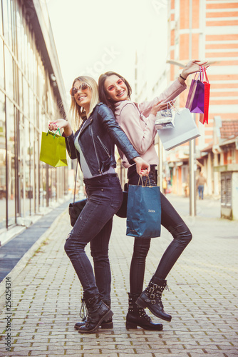 two happy girls shopping friendship free time modern lifestyle concept