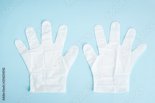 Wallpaper Mural White gloves to moisturize the skin of the hands. Saloon and home care for hands.Close-up. Blue background. View from above. Torontodigital.ca