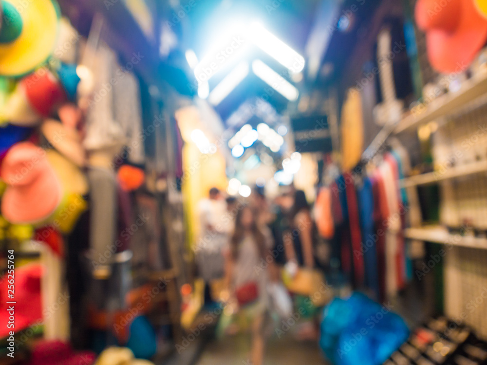Blurred group of tourist people shopping in souvenir shop Blurred group of tourist people shopping in souvenir shop